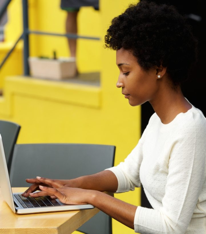 demo-attachment-21-attractive-young-woman-using-laptop-outside-P9RLFGU